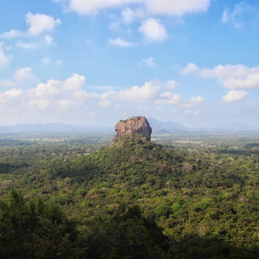 Breathtaking aerial view of the iconic Sigiriya Rock surrounded by lush forest in Sri Lanka