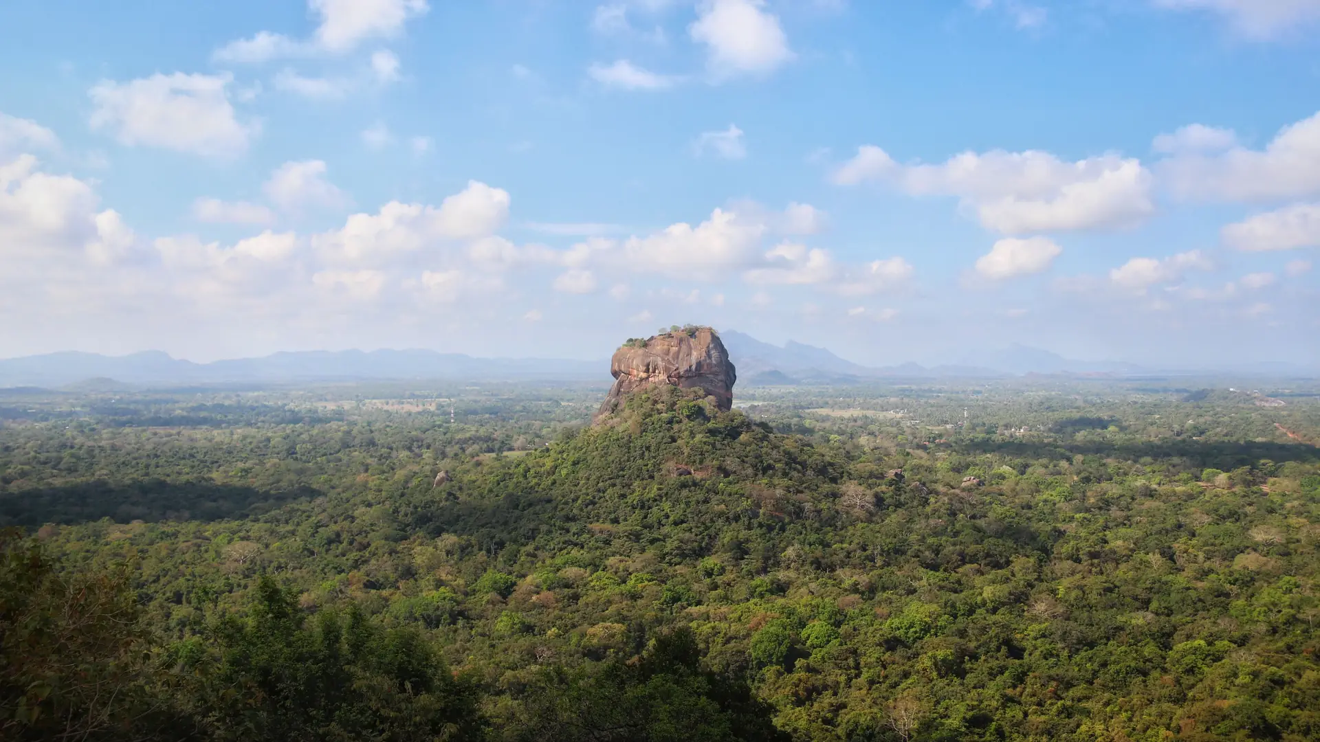 Breathtaking aerial view of the iconic Sigiriya Rock surrounded by lush forest in Sri Lanka